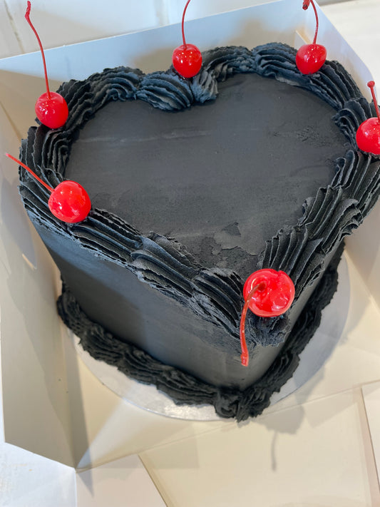 heart cake with cherries