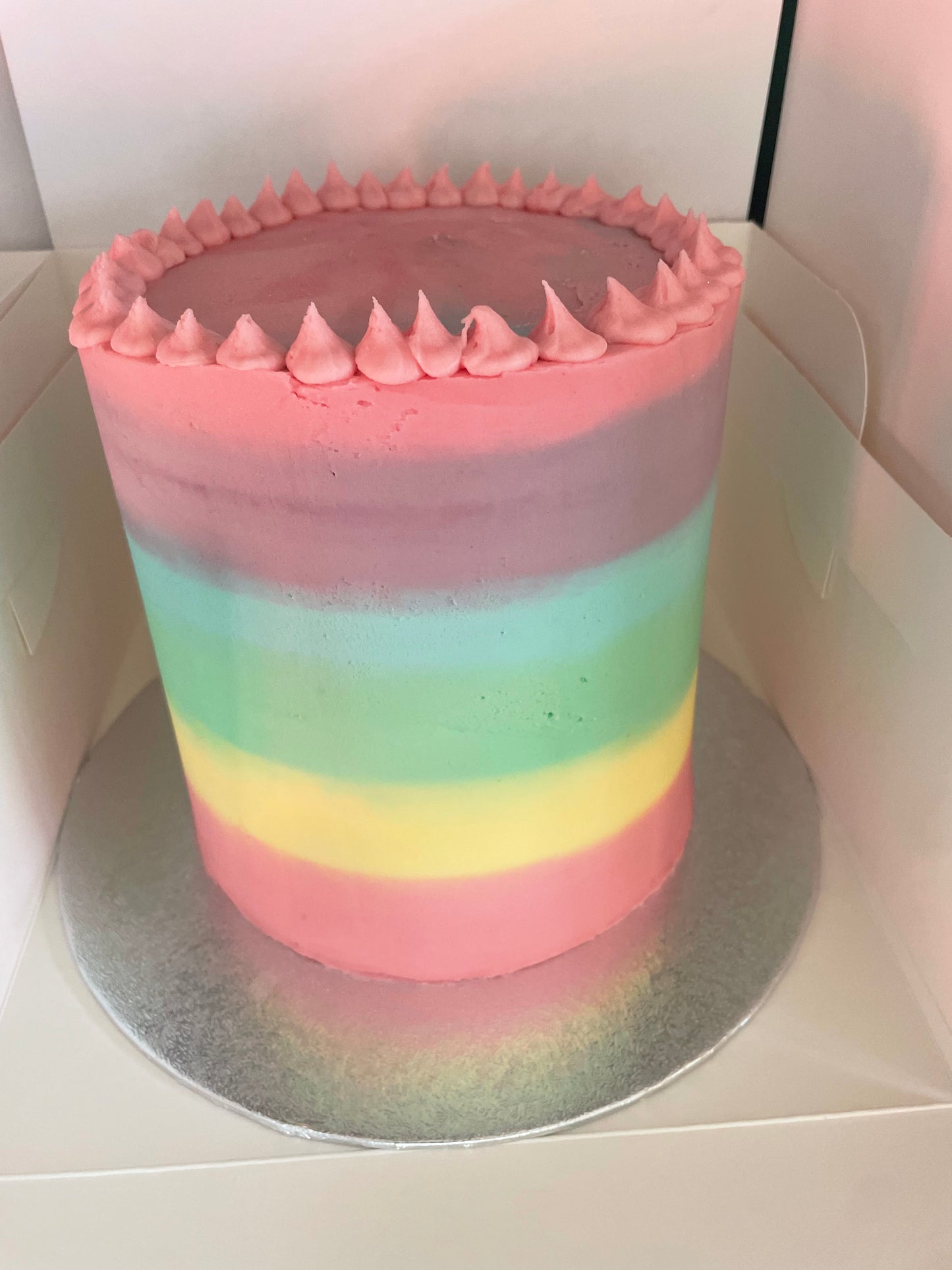 Pastel rainbow iced cake